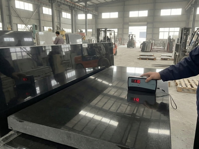 Gloss meter testing black granite