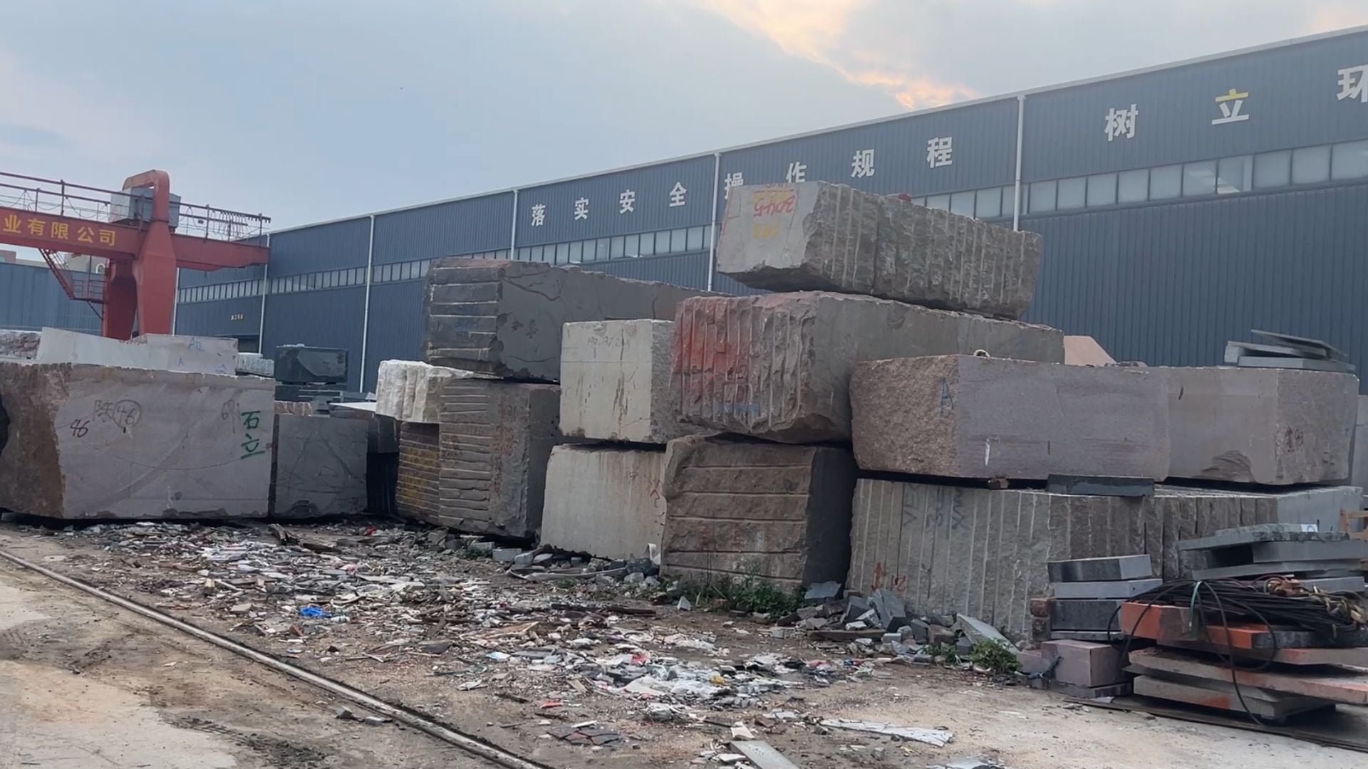 Granite blocks arranged outside the workshop