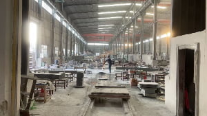 Granite monument components being polished in the workshop
