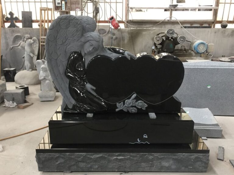 Carved black granite memorial in the workshop before final delivery