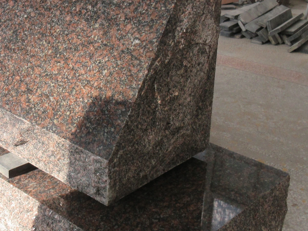 Close view of rock-pitched slant edge and polished granite nosing