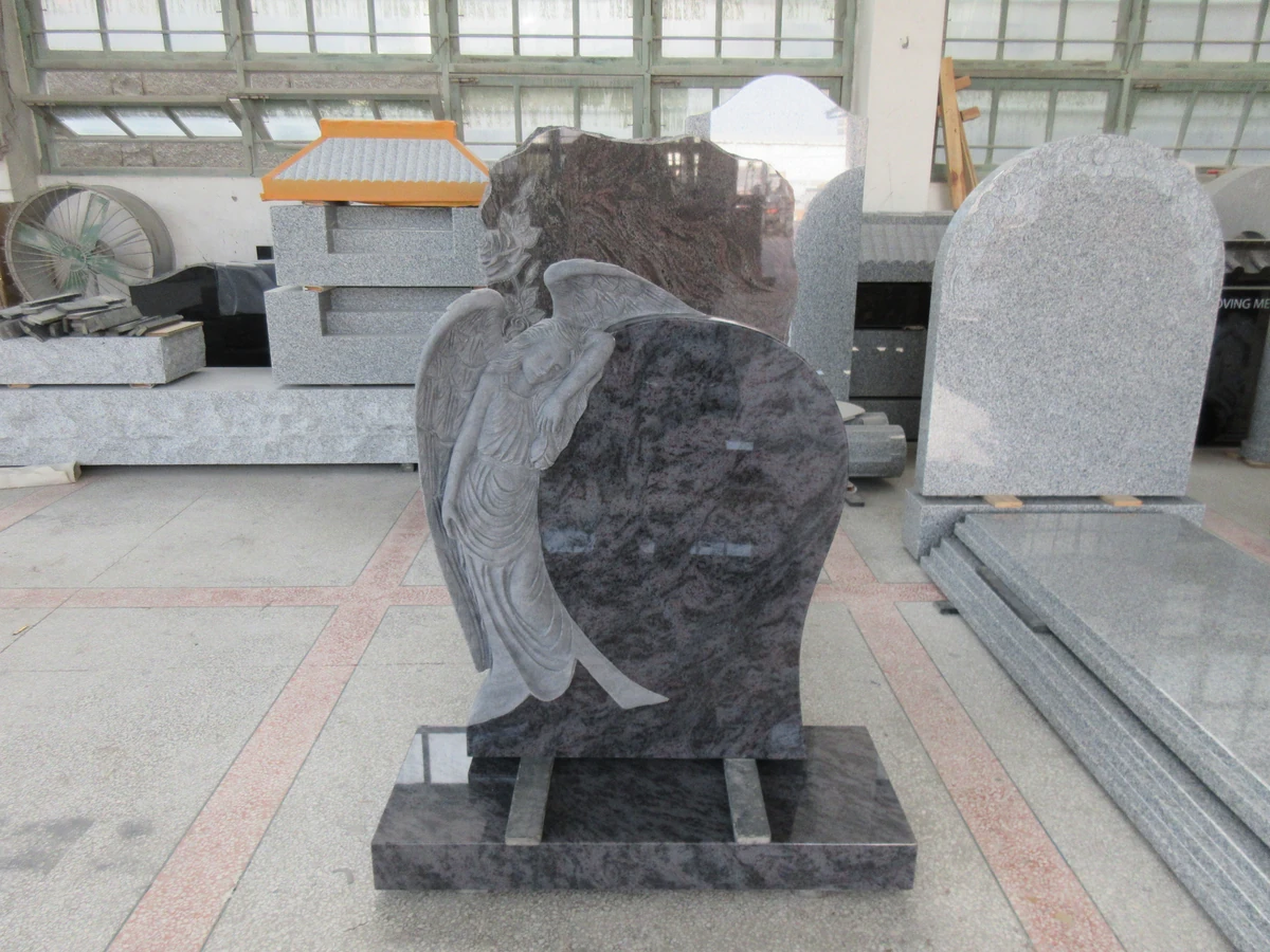 Unlettered angel and heart memorial in veined granite